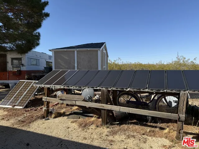 a view of a roof deck with wooden fence
