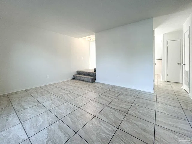 a view of an empty room and window