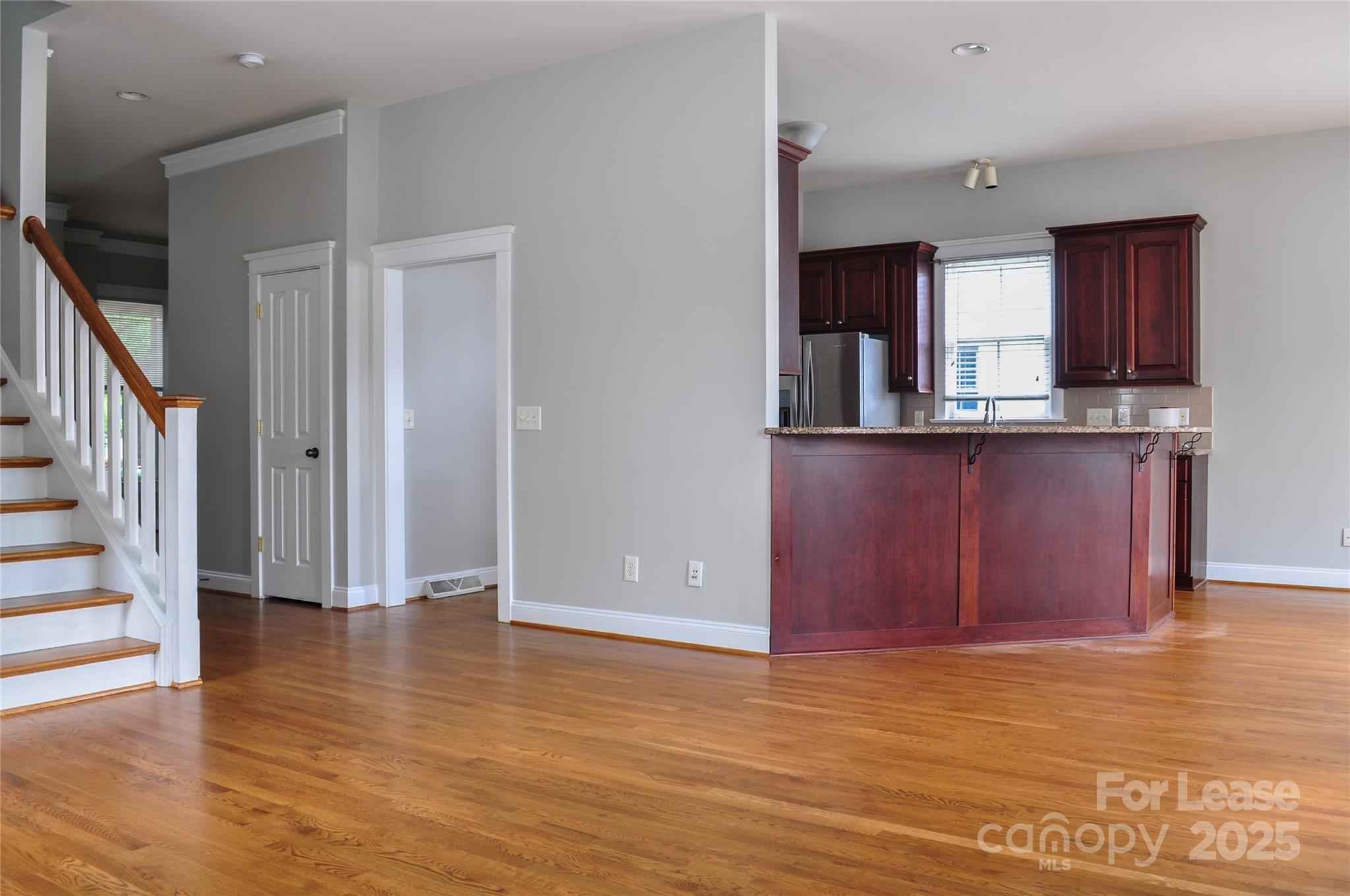3010 Colonel Springs Way Fort Mill, SC 29708 - Photo 7 of 17 a view of a kitchen with wooden floor and electronic appliances