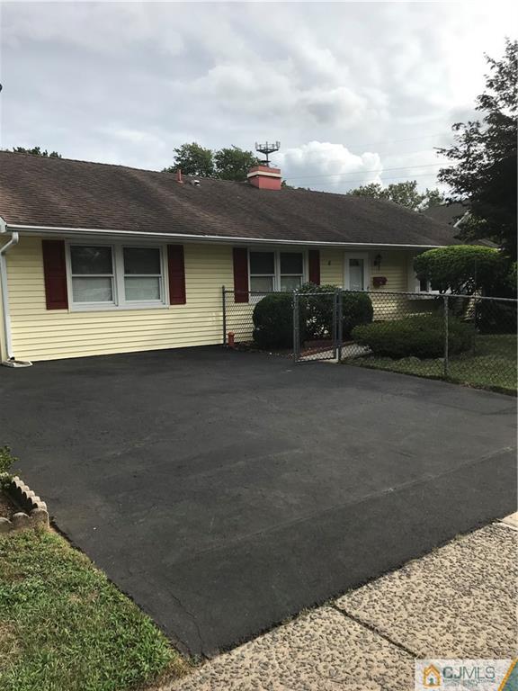 8 Winthrop Road Edison, NJ 08817 - Photo 2 of 2 a front view of a house with a yard