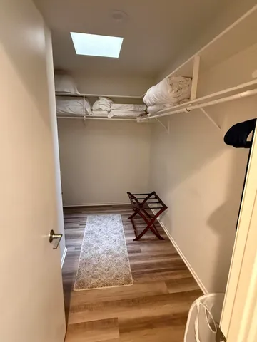 a view of a room with rack and wooden floor