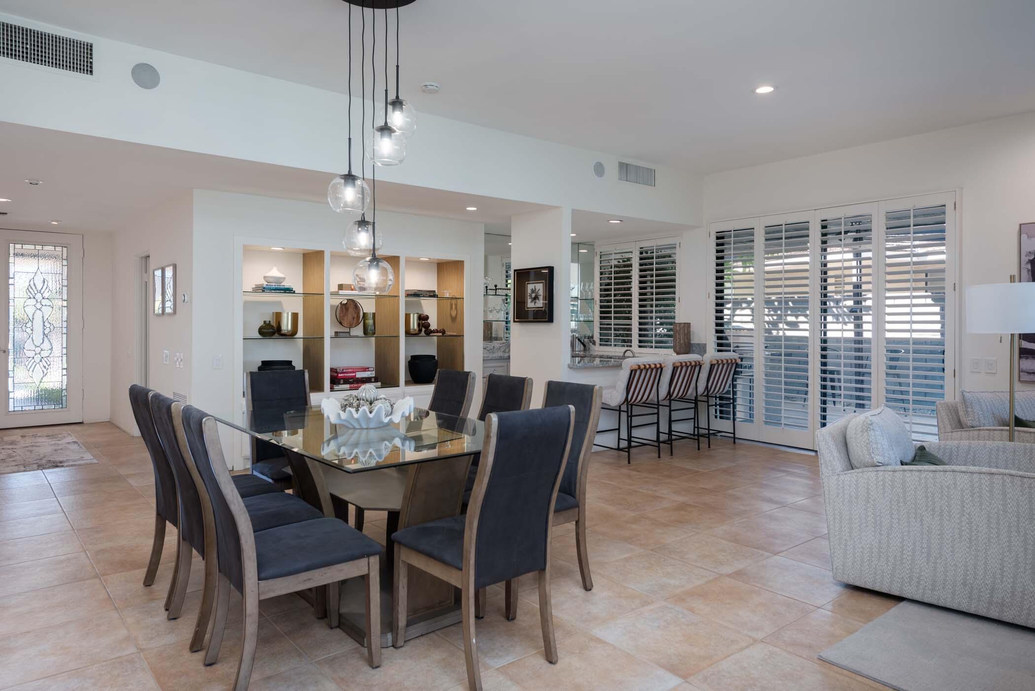 2 Lehigh Court Rancho Mirage, CA 92270 - Photo 15 of 43 a dining room with furniture a chandelier and window