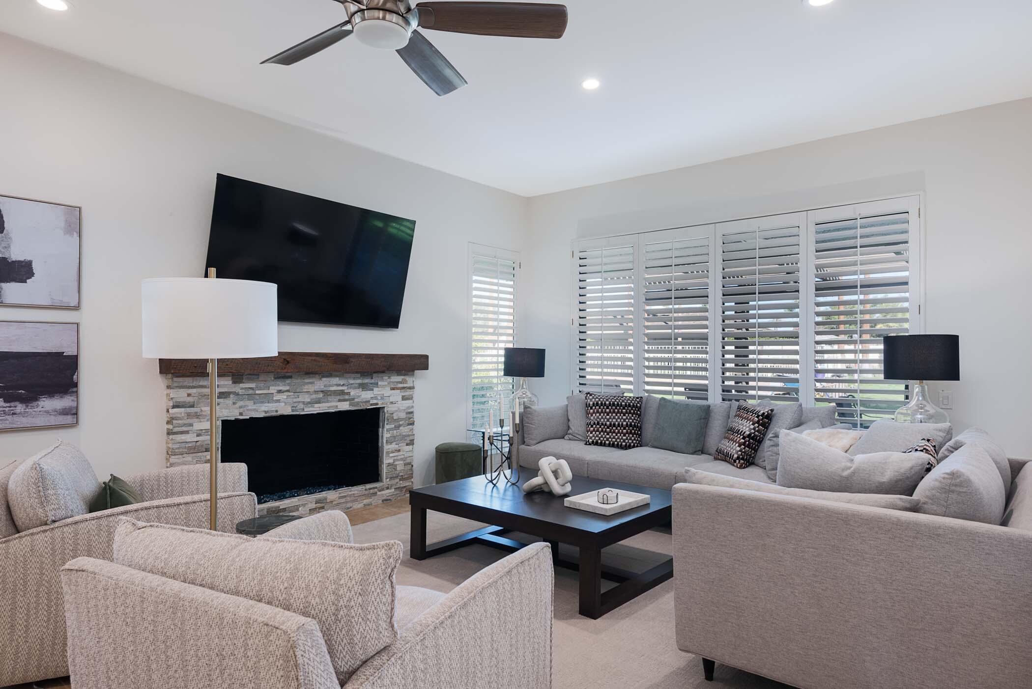 2 Lehigh Court Rancho Mirage, CA 92270 - Photo 17 of 43 a living room with furniture a fireplace and a flat screen tv