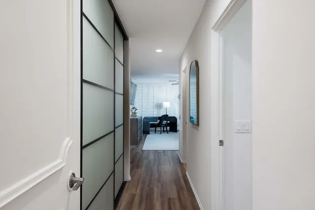 a bedroom with a bed and a chair