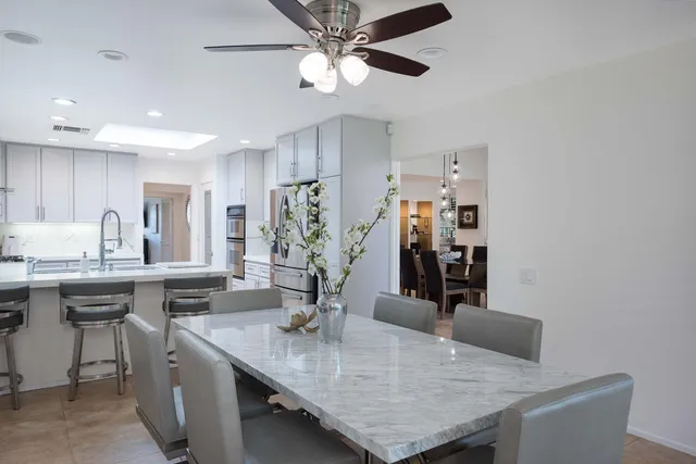 a kitchen with a sink stove top oven and cabinets