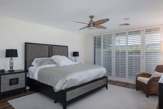 a bedroom with a bed and a fireplace