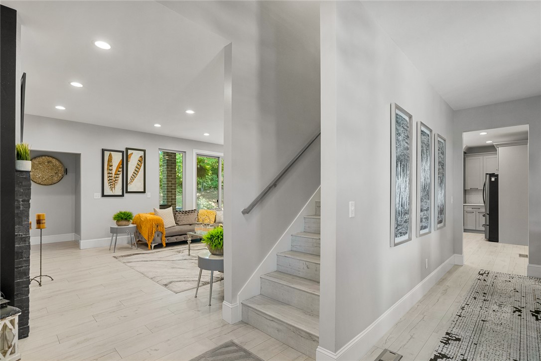 140 Turnberry Road Anderson, SC 29621 - Photo 5 of 44 This bright interior features an open-concept living space with sleek flooring and inviting natural light.