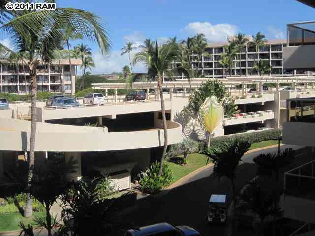 2575 South Kihei Road, Unit G307 Kihei, HI 96753 - Photo 20 of 25 a view of a swimming pool with outdoor seating and plants