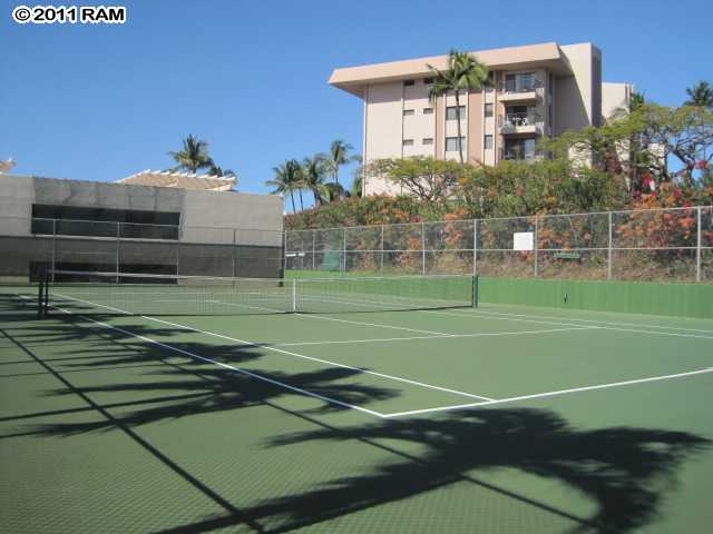 2575 South Kihei Road, Unit G307 Kihei, HI 96753 - Photo 25 of 25 a view of a tennis ground with a large trees