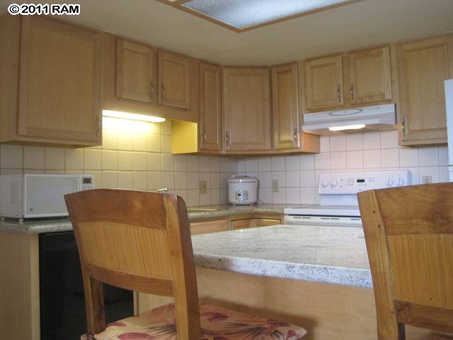 2575 South Kihei Road, Unit G307 Kihei, HI 96753 - Photo 5 of 25 a kitchen with a sink and cabinets