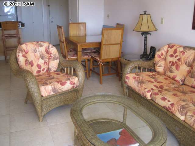 2575 South Kihei Road, Unit G307 Kihei, HI 96753 - Photo 7 of 25 a living room with a couch and a chandelier