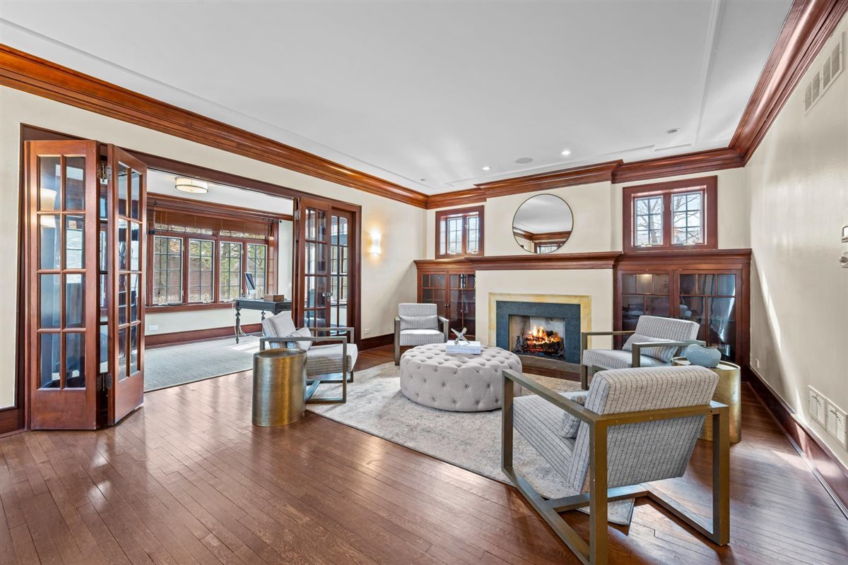 224 Sheridan Road Kenilworth, IL 60043 - Photo 11 of 62 a living room with furniture and a fireplace