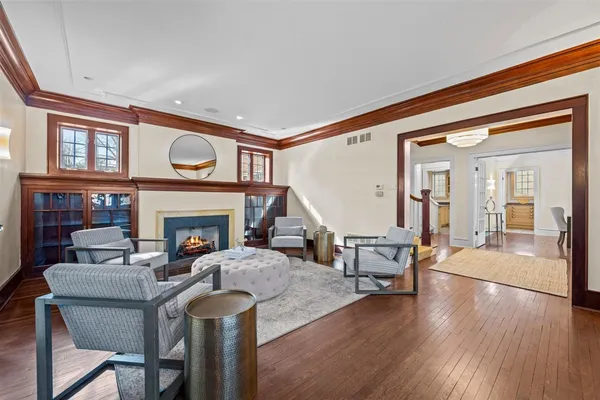 a view of entryway livingroom and hall with wooden floor