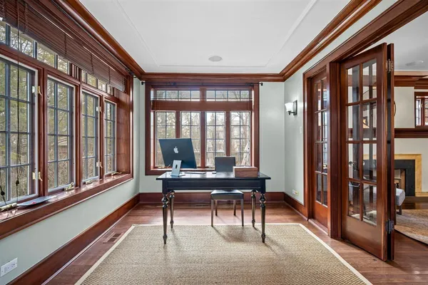 a view of a dining room with furniture window and wooden floor