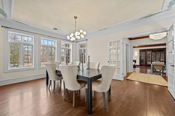 a view of a dining room with furniture and window