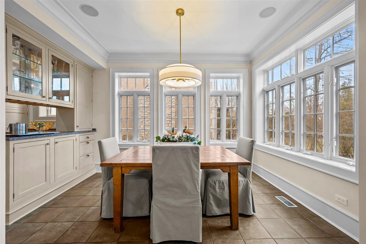 224 Sheridan Road Kenilworth, IL 60043 - Photo 18 of 62 a view of a dining room with furniture window and wooden floor
