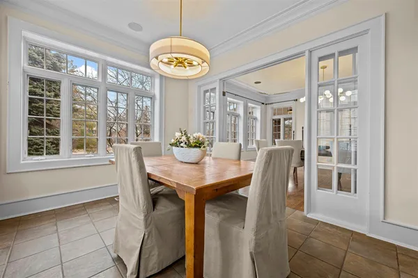 a kitchen with stainless steel appliances kitchen island granite countertop a stove a sink and a refrigerator