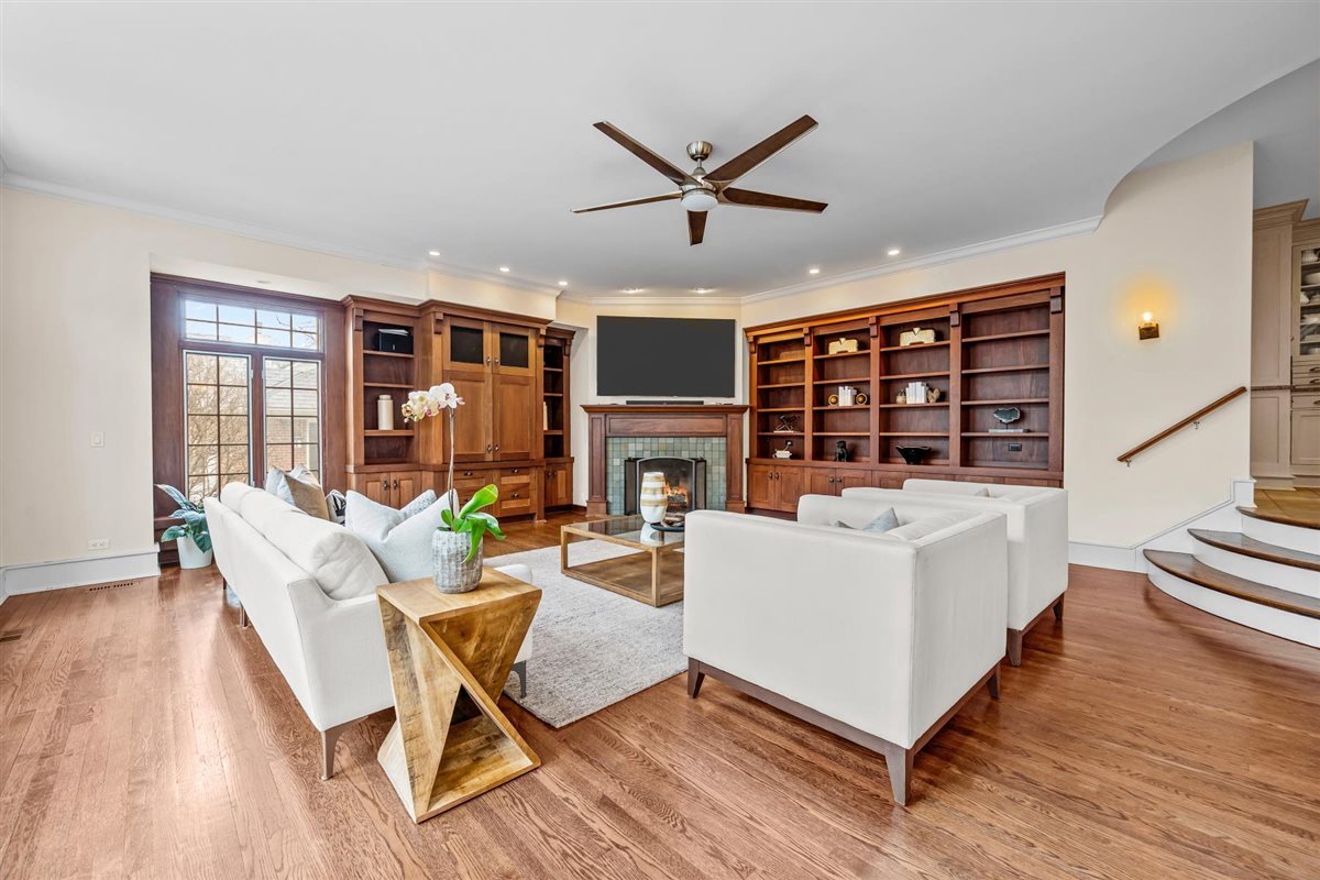 224 Sheridan Road Kenilworth, IL 60043 - Photo 26 of 62 a living room with fireplace furniture and a wooden floor