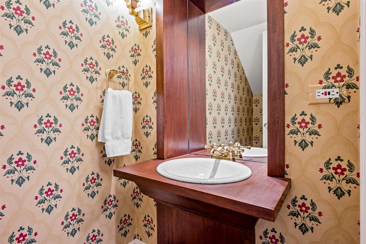 224 Sheridan Road Kenilworth, IL 60043 - Photo 28 of 62 a bathroom with a sink and a mirror