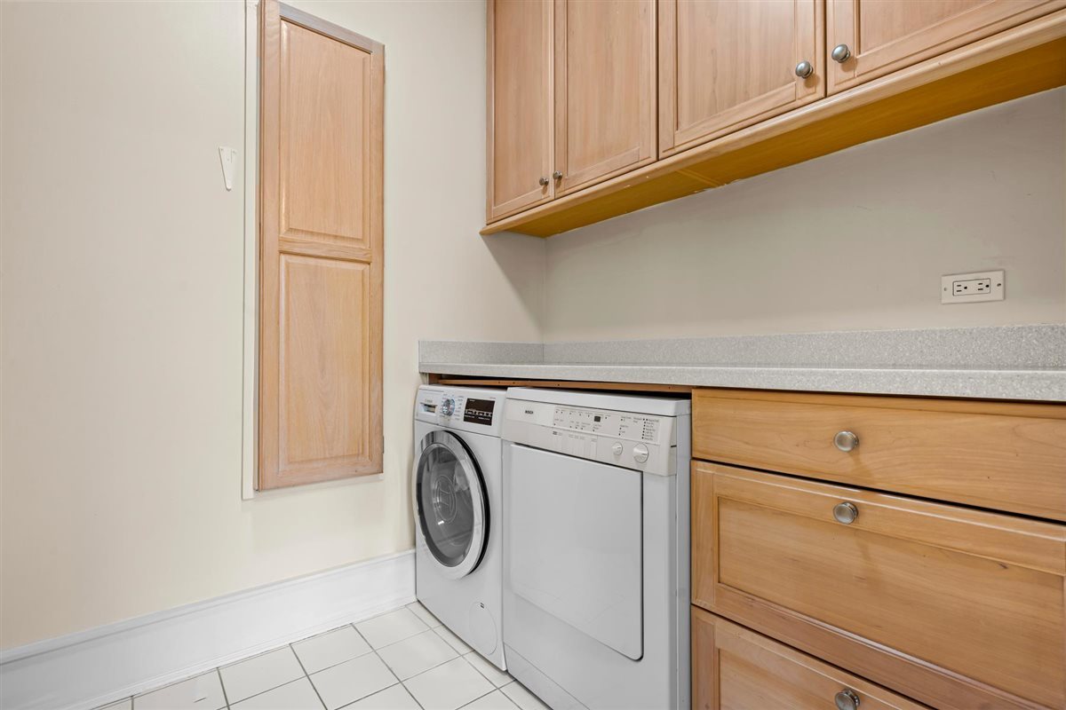 224 Sheridan Road Kenilworth, IL 60043 - Photo 31 of 62 a close view of utility room with washer and dryer
