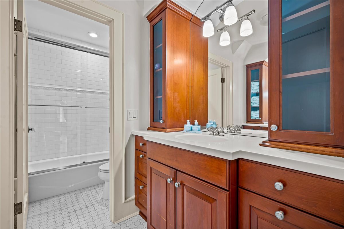 224 Sheridan Road Kenilworth, IL 60043 - Photo 41 of 62 a bathroom with a sink and a mirror