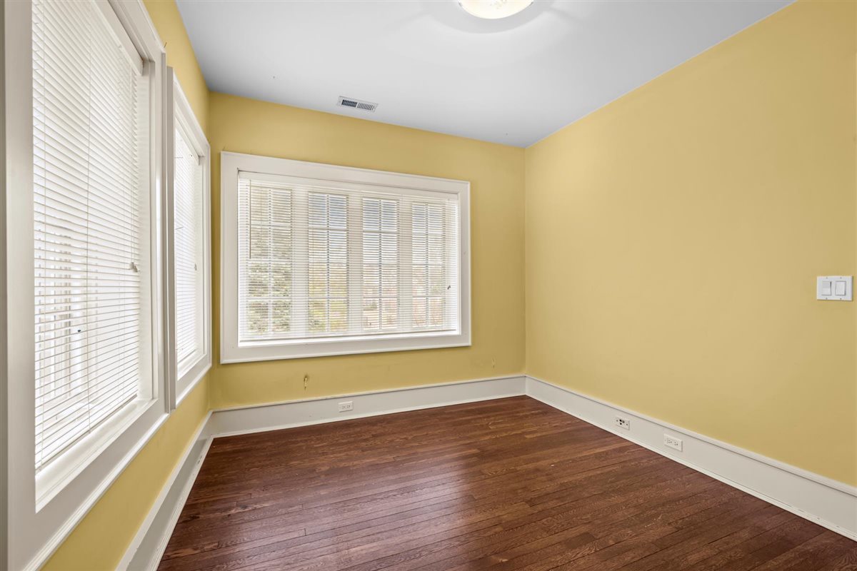 224 Sheridan Road Kenilworth, IL 60043 - Photo 44 of 62 a view of an empty room with wooden floor and a window