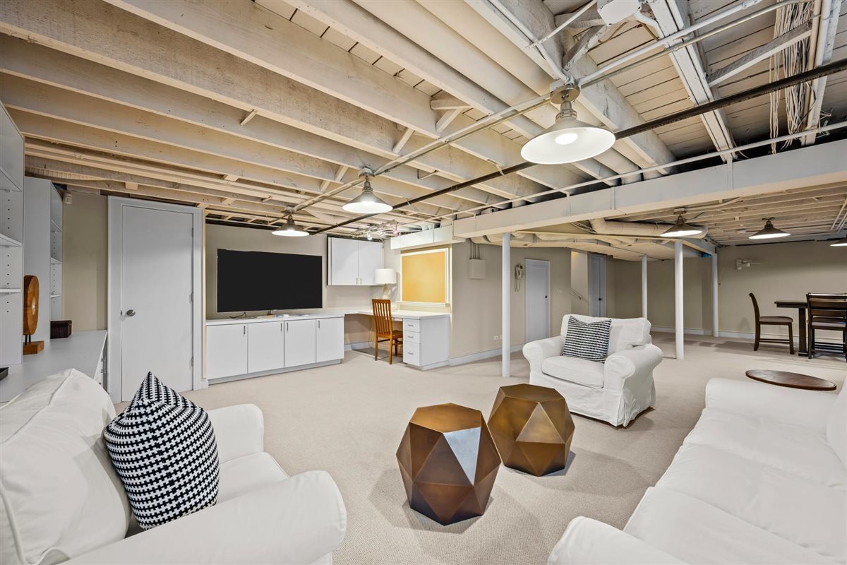 224 Sheridan Road Kenilworth, IL 60043 - Photo 49 of 62 a living room with furniture and a flat screen tv