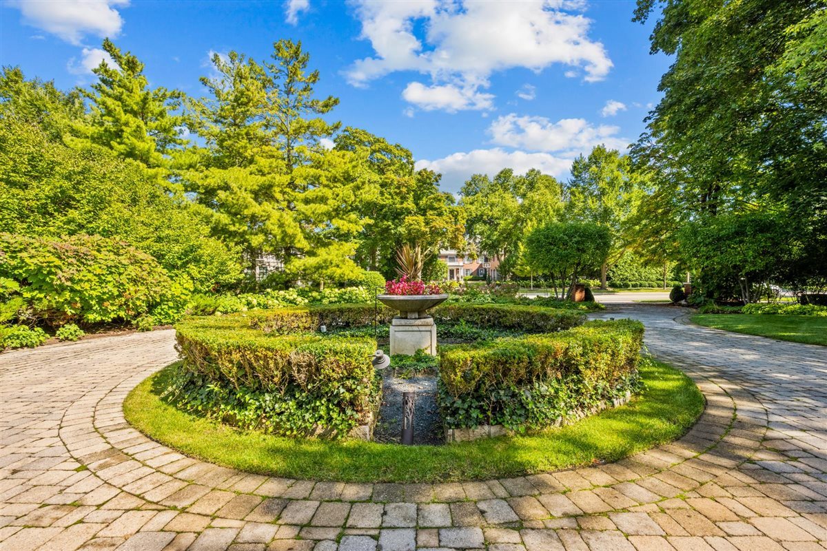 224 Sheridan Road Kenilworth, IL 60043 - Photo 5 of 62 a view of a garden with a fountain