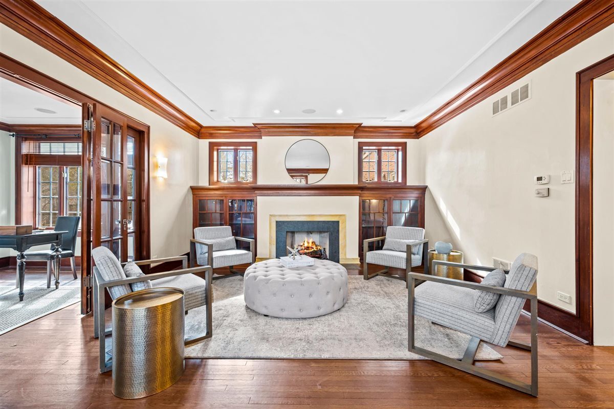224 Sheridan Road Kenilworth, IL 60043 - Photo 10 of 62 a living room with furniture and a fireplace