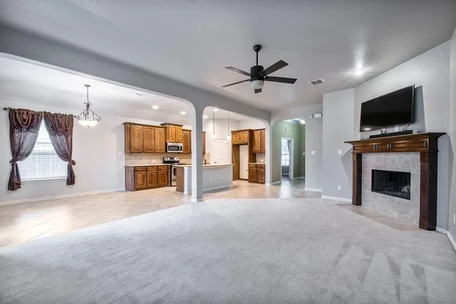 a kitchen with kitchen island a sink stainless steel appliances and a counter top