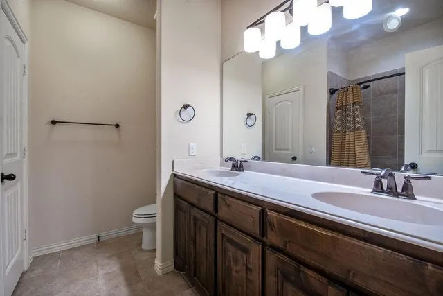 a view of an empty room with a ceiling fan