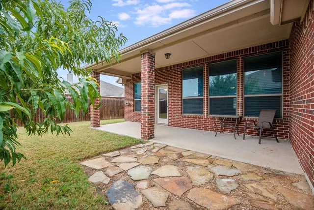 an empty room with a empty space and windows