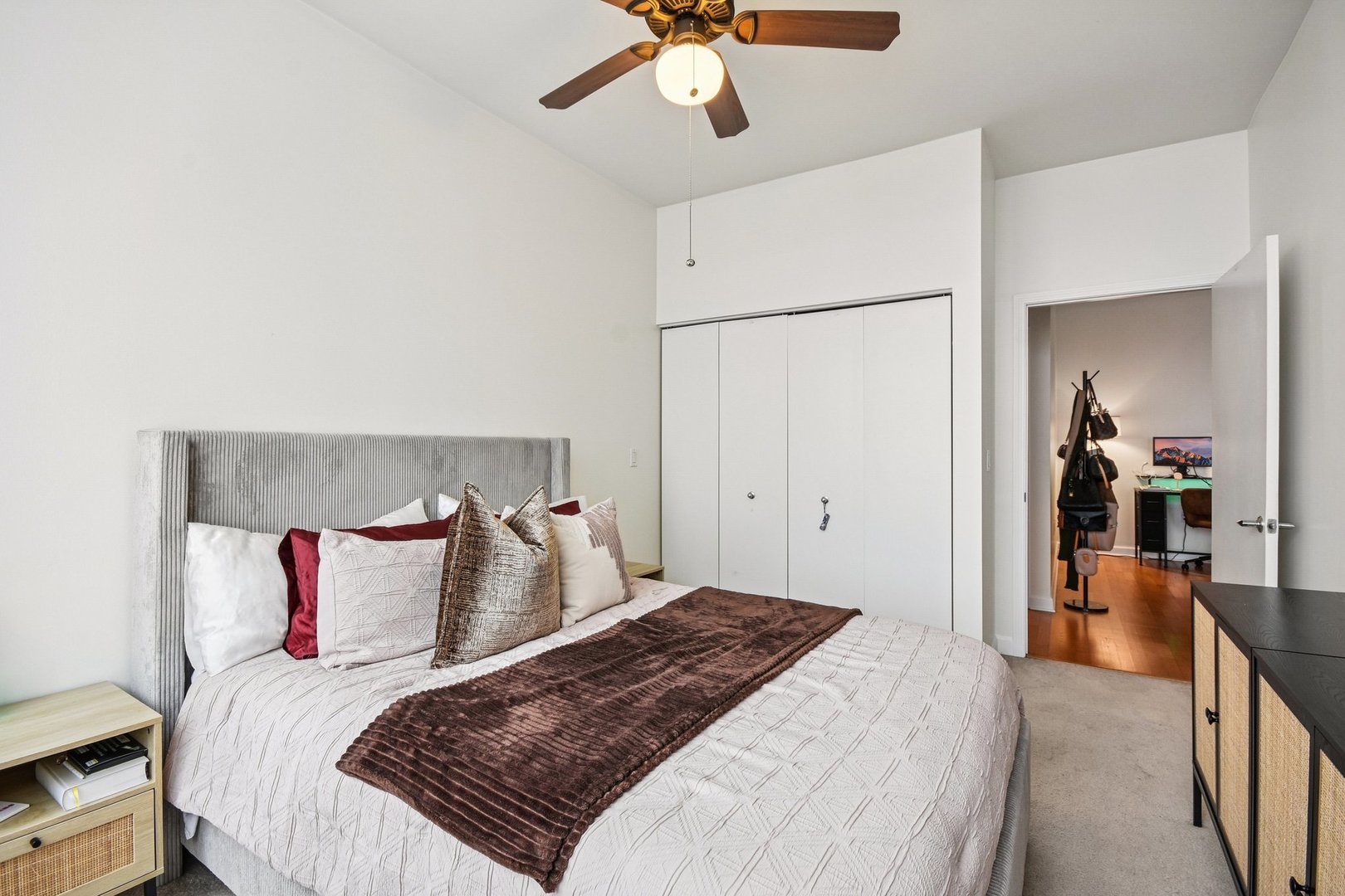 233 East 13th Street, Unit 1008 Chicago, IL 60605 - Photo 11 of 27 a bedroom with a bed and a chandelier