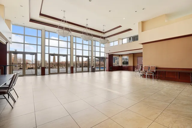 a view of an entryway with a dining table & chairs