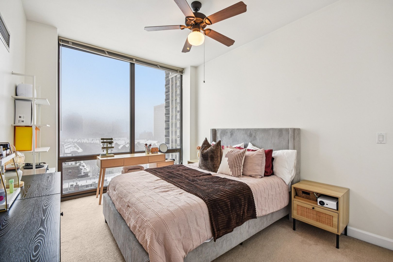 233 East 13th Street, Unit 1008 Chicago, IL 60605 - Photo 10 of 27 a bedroom with a bed a chandelier and a chandelier