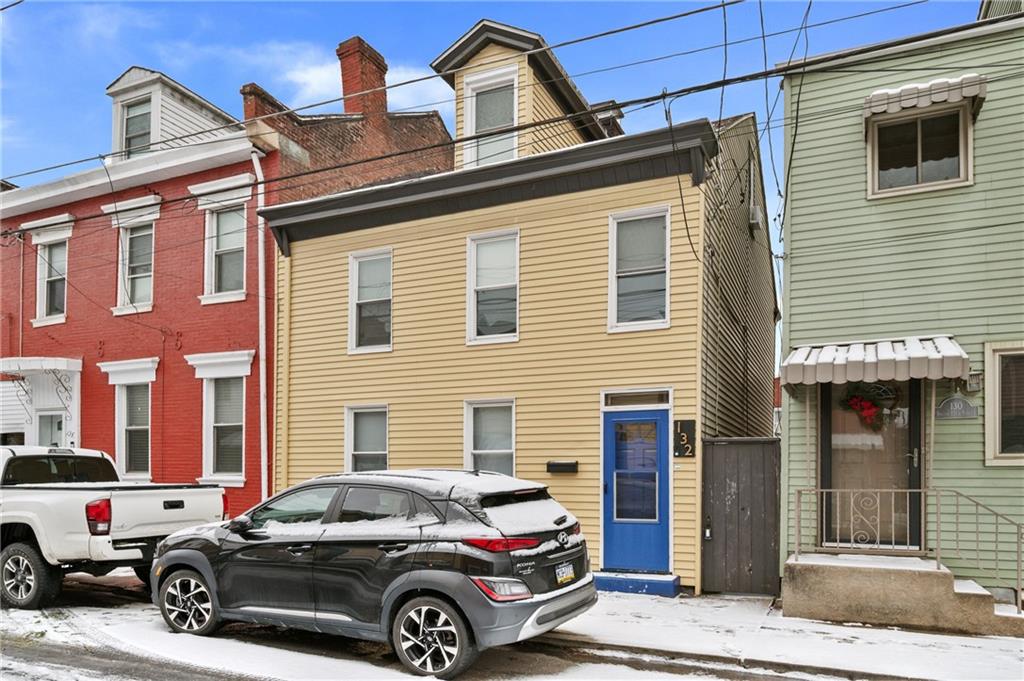 a car parked in front of a house