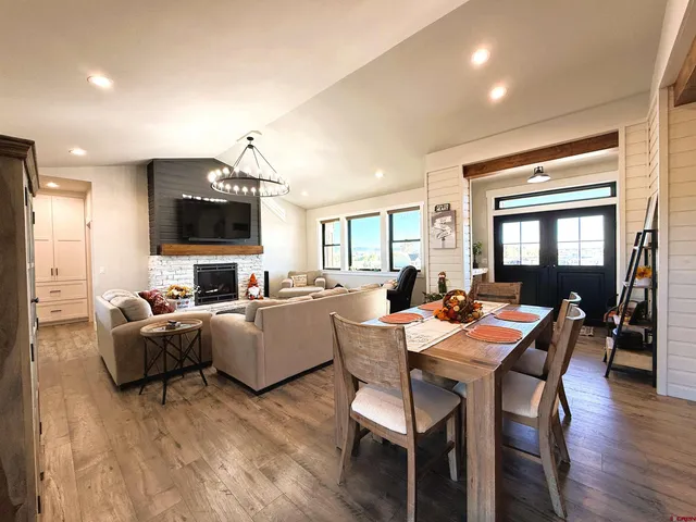 a living room with fireplace furniture and a flat screen tv