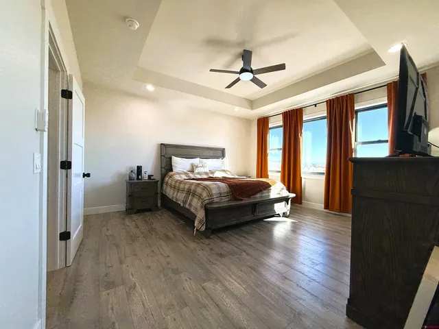 a large white kitchen with a large window