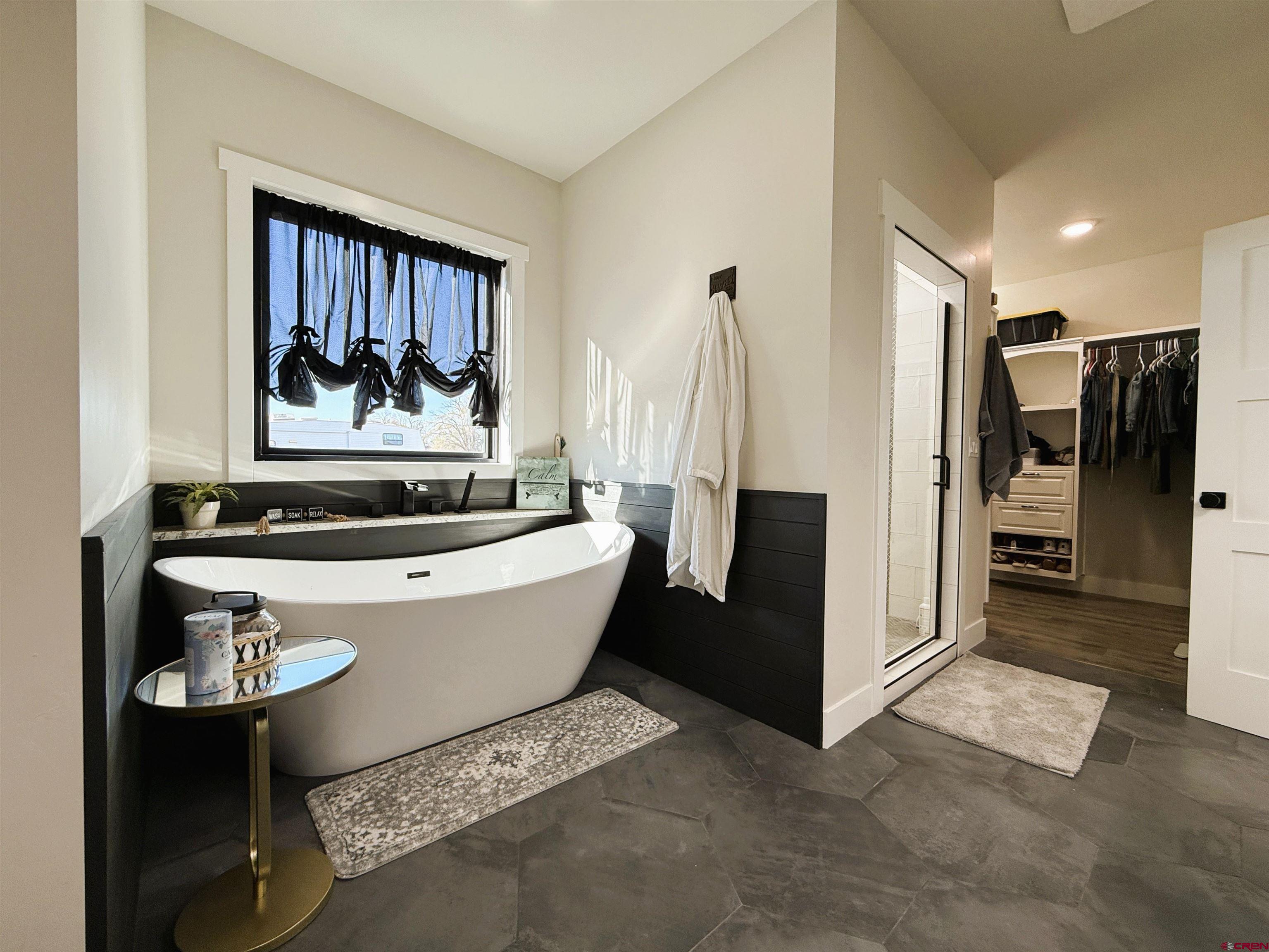 8585 Ellens Way Austin, CO 81410 - Photo 35 of 45 a living room with furniture and a painting on the wall