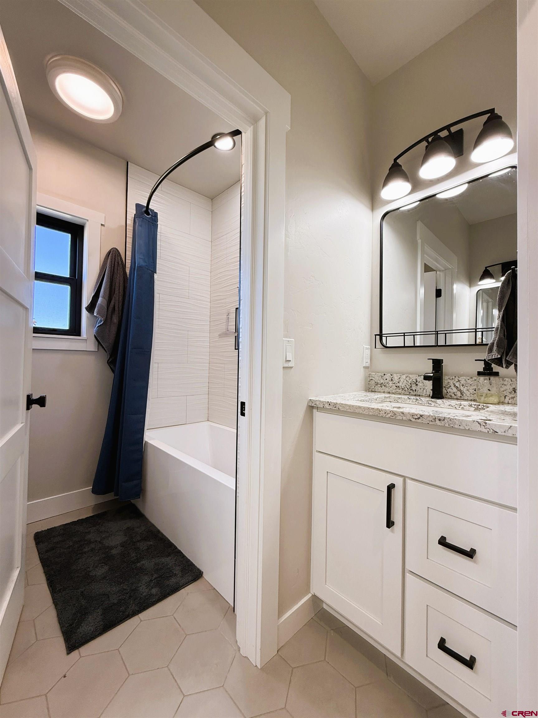 8585 Ellens Way Austin, CO 81410 - Photo 43 of 45 a bathroom with a sink and a mirror