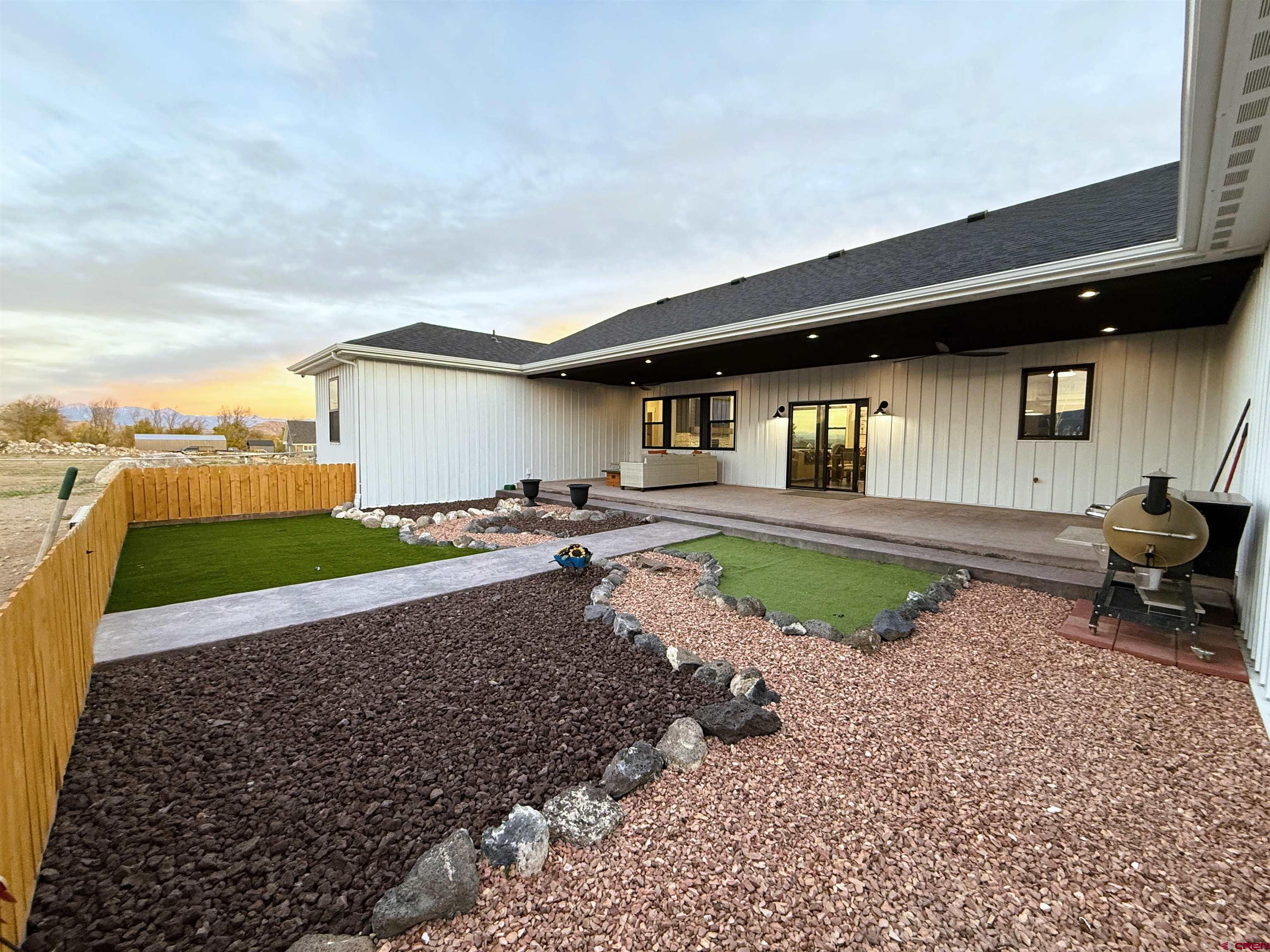 8585 Ellens Way Austin, CO 81410 - Photo 7 of 45 a view of a backyard with plants and a patio