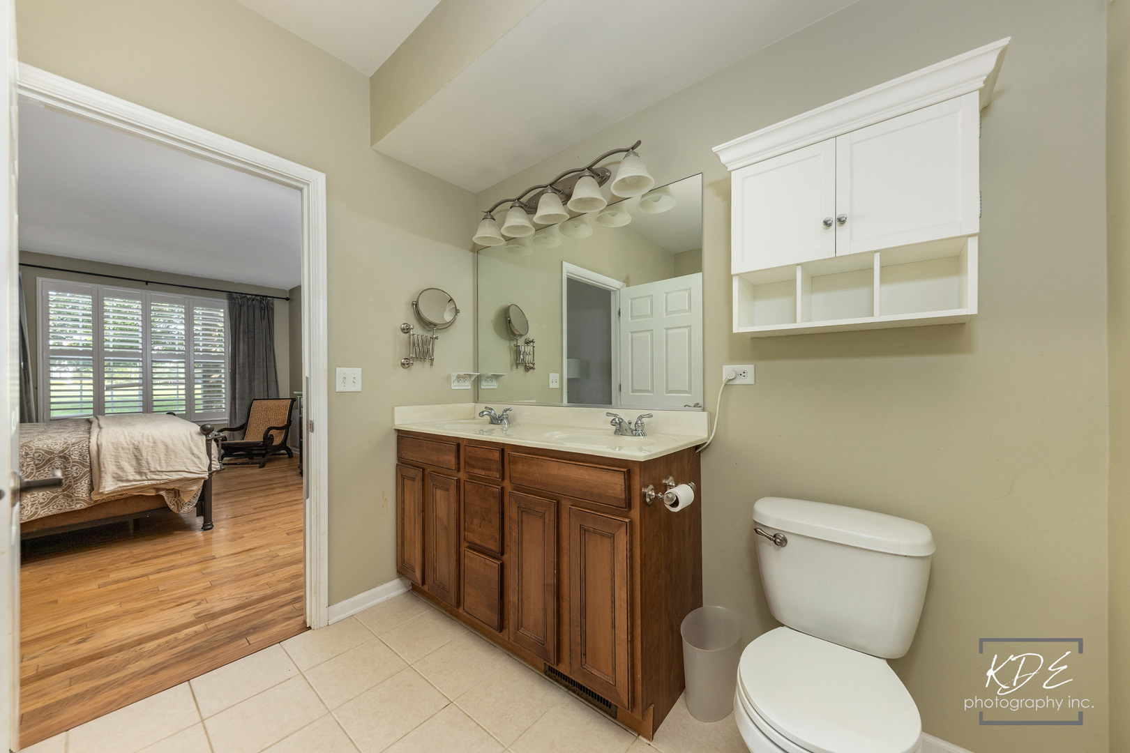 1022 Neudearborn Lane, Unit 191022 Naperville, IL 60563 - Photo 14 of 27 a bathroom with a toilet sink and mirror