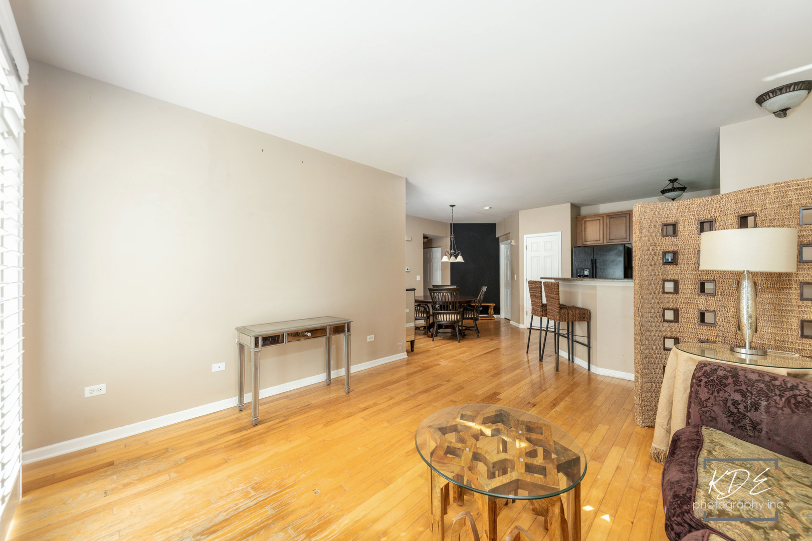 1022 Neudearborn Lane, Unit 191022 Naperville, IL 60563 - Photo 6 of 27 a living room with furniture a dining table and chairs with kitchen view