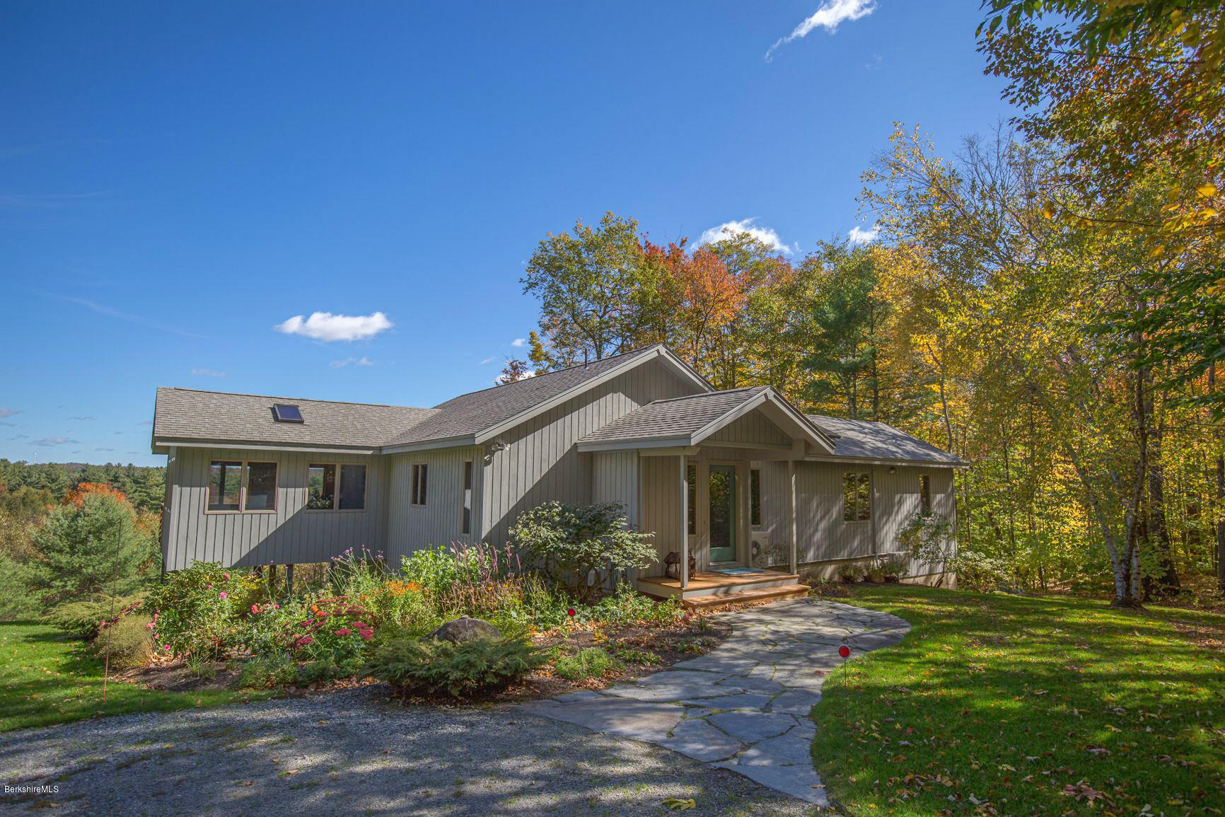 358 Harrington Road Otis, MA 01253 - Photo 2 of 52 a front view of a house with garden