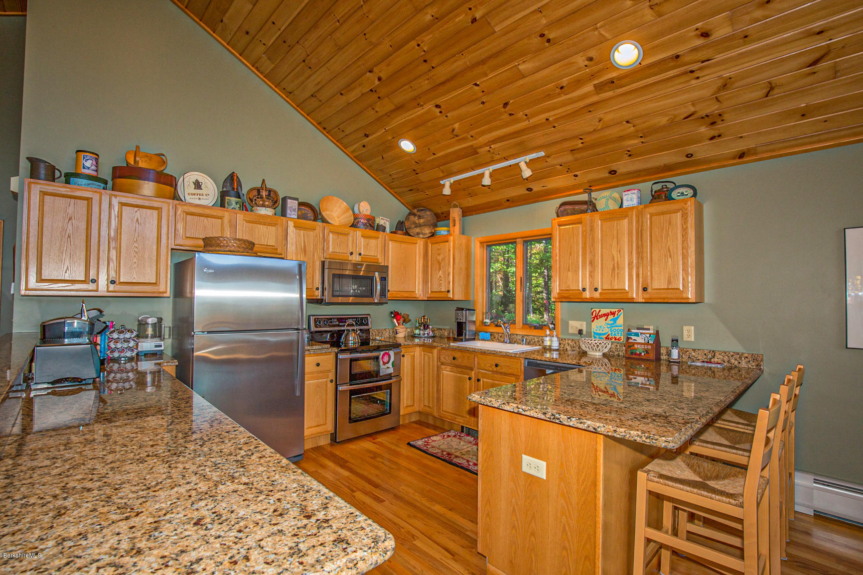 358 Harrington Road Otis, MA 01253 - Photo 11 of 52 a kitchen with stainless steel appliances granite countertop a sink stove and refrigerator