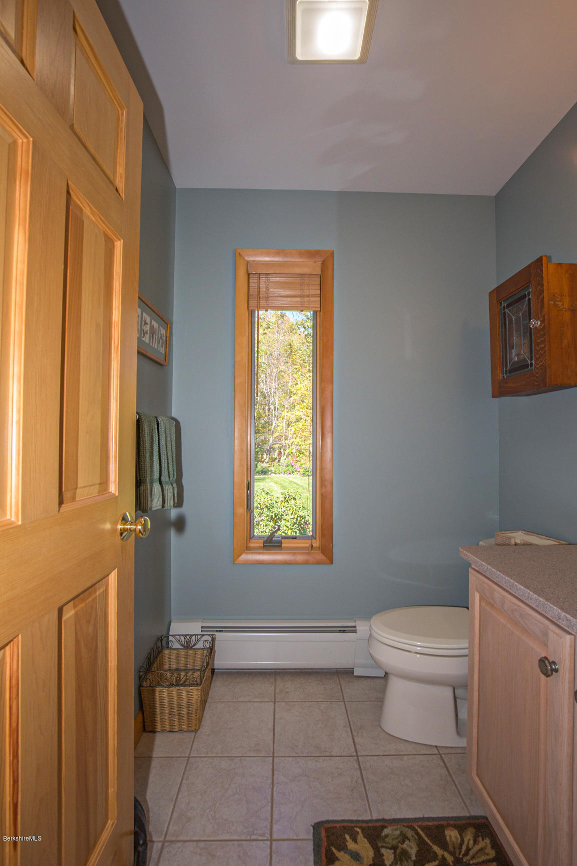 358 Harrington Road Otis, MA 01253 - Photo 16 of 52 a bathroom with a toilet a sink and a window