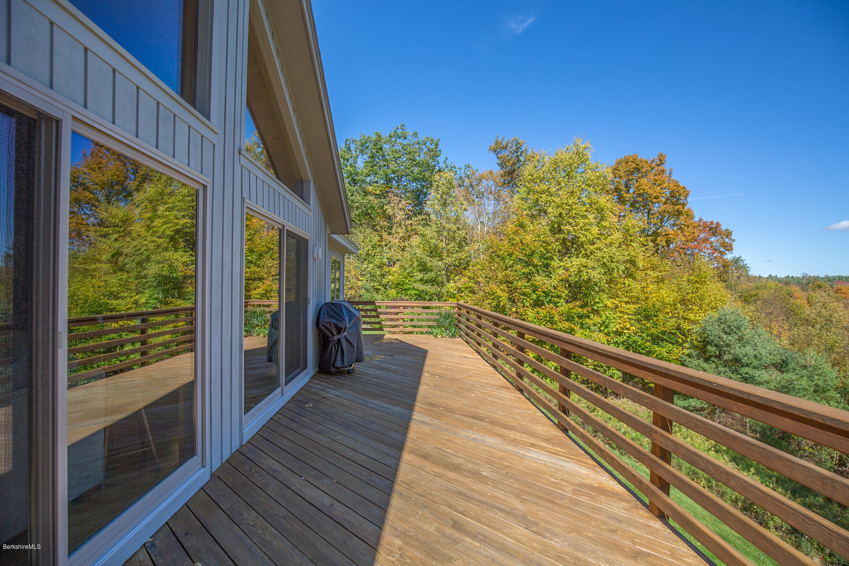 358 Harrington Road Otis, MA 01253 - Photo 18 of 52 a view of balcony with wooden floor and fence