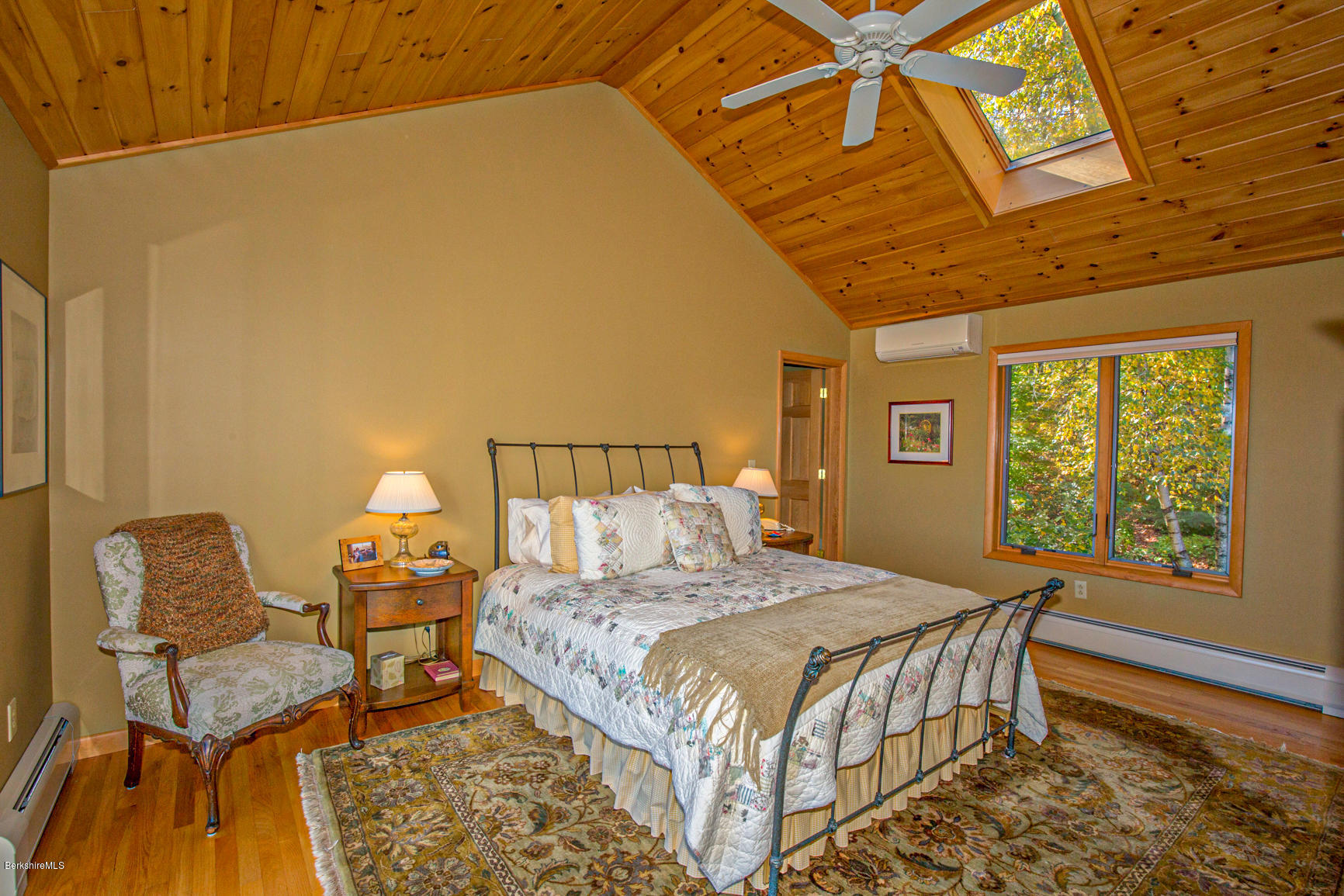 358 Harrington Road Otis, MA 01253 - Photo 20 of 52 a bedroom with a bed and wooden floor