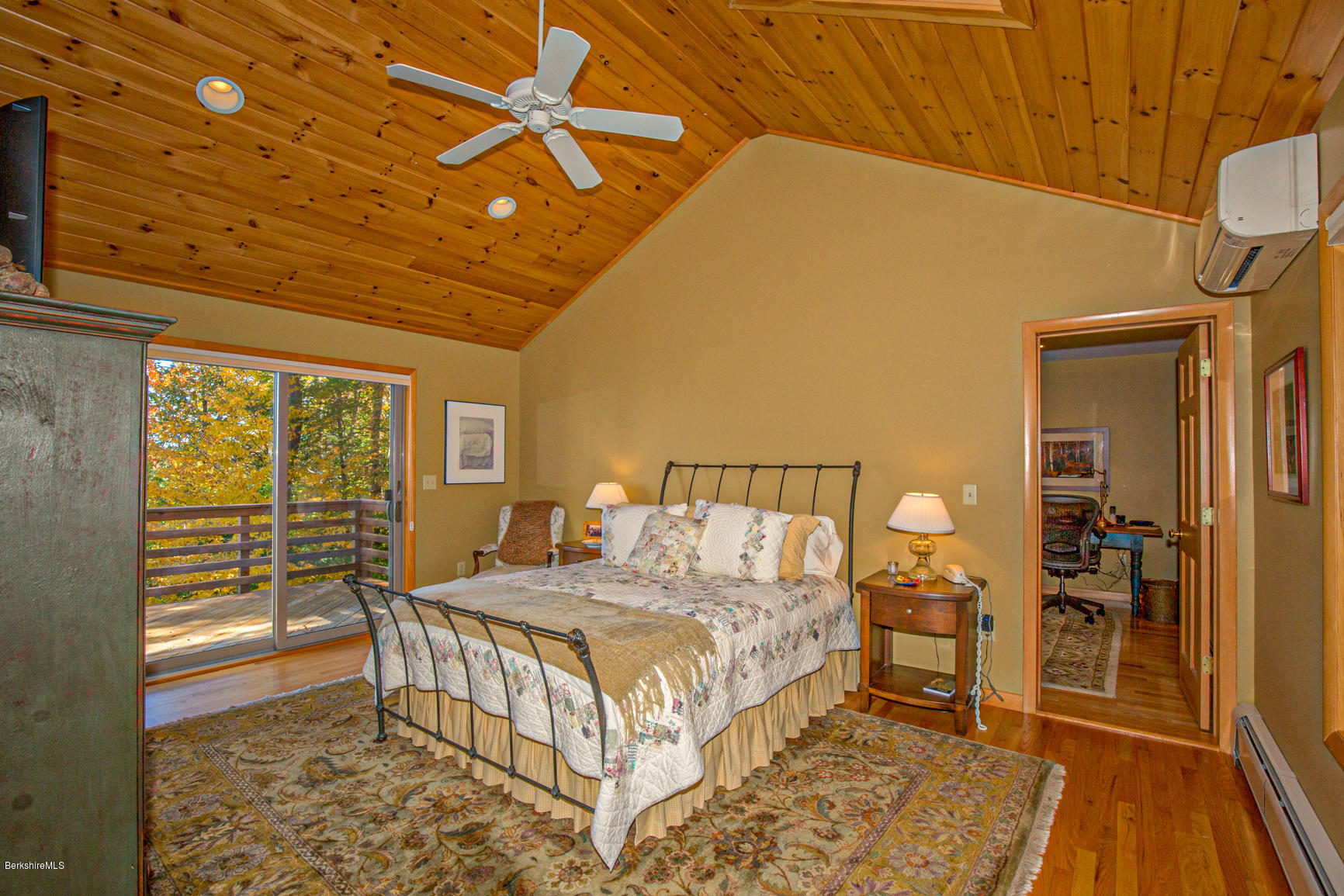358 Harrington Road Otis, MA 01253 - Photo 21 of 52 a bedroom with a bed and a view of en suite bathroom