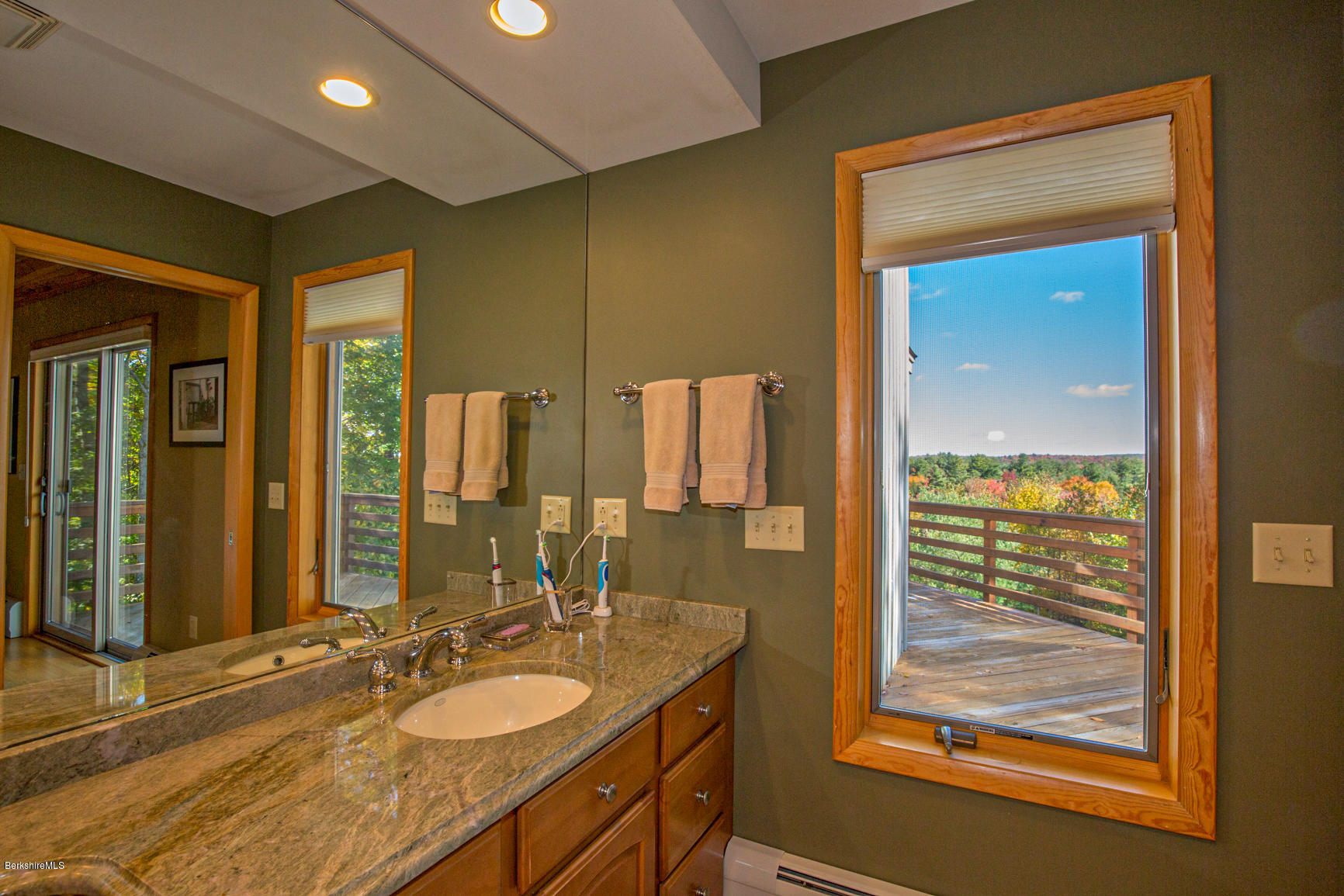 358 Harrington Road Otis, MA 01253 - Photo 25 of 52 a bathroom with a granite countertop sink a mirror and a shower